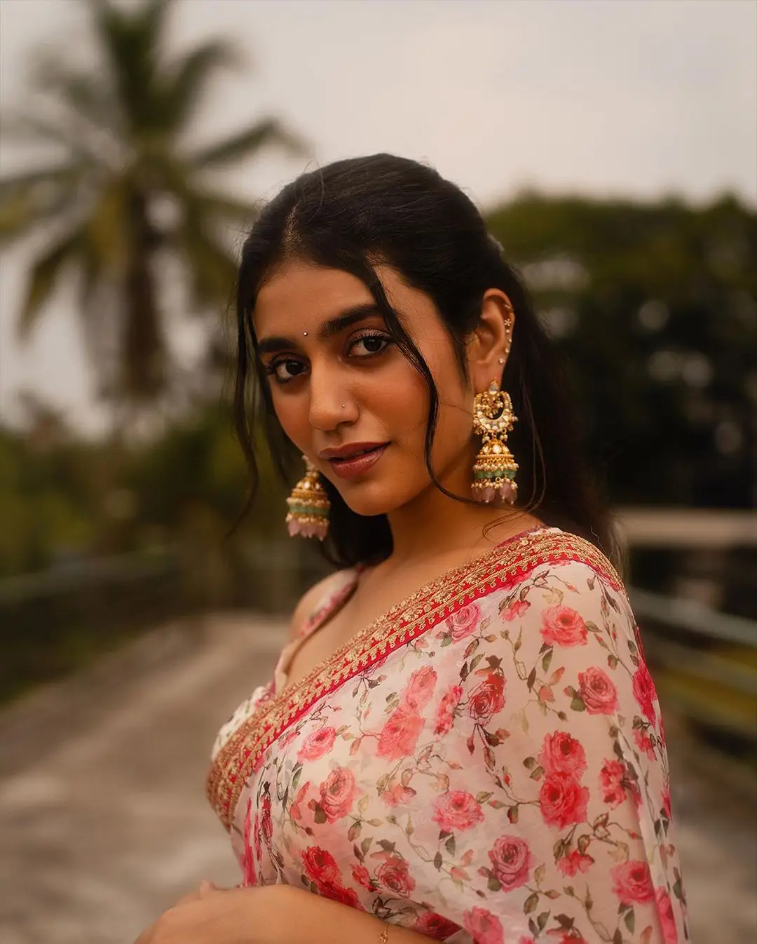 Priya Prakash Varrier Stills in Red Saree Sleeveless Blouse